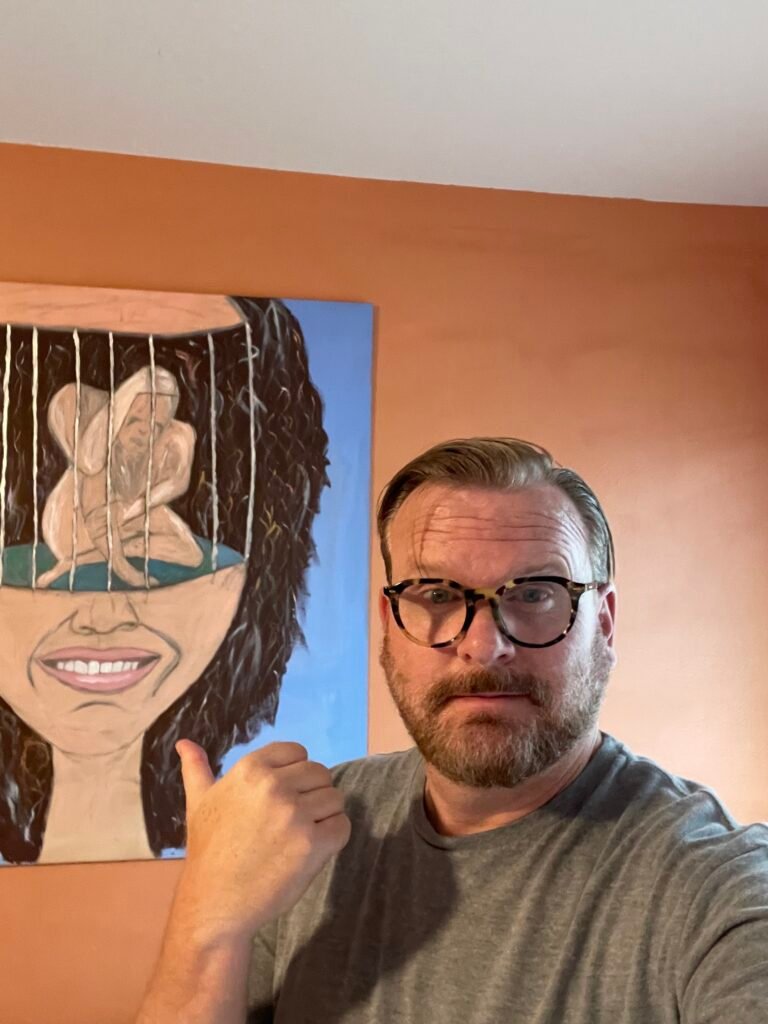 Mike with one of his paintings