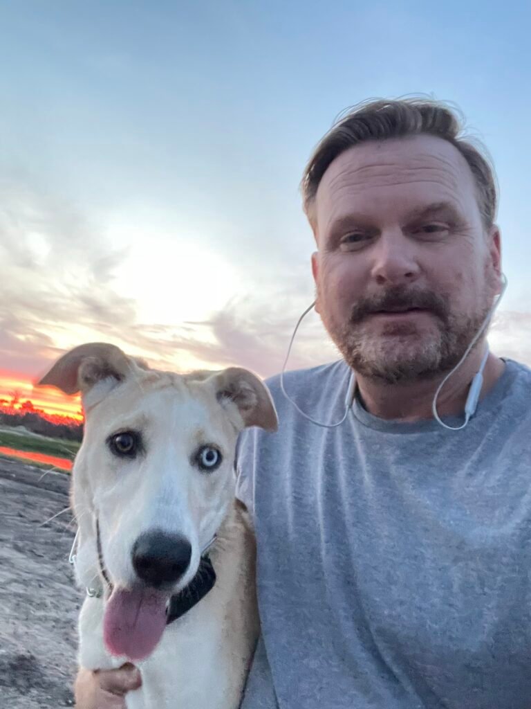 Mike and his dog at the beach